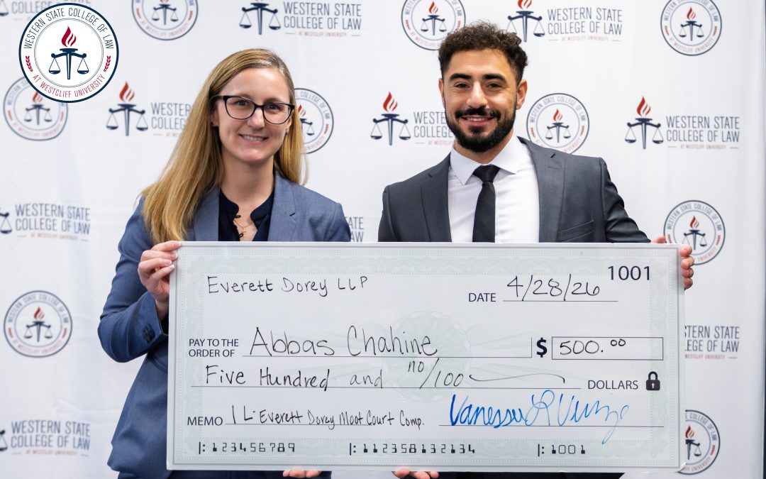 Winner Abbas Chahine receives his check from Vanessa Vinje