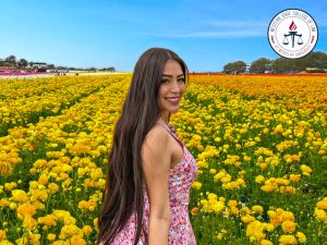 Eleni Martinez in a field of flowers.