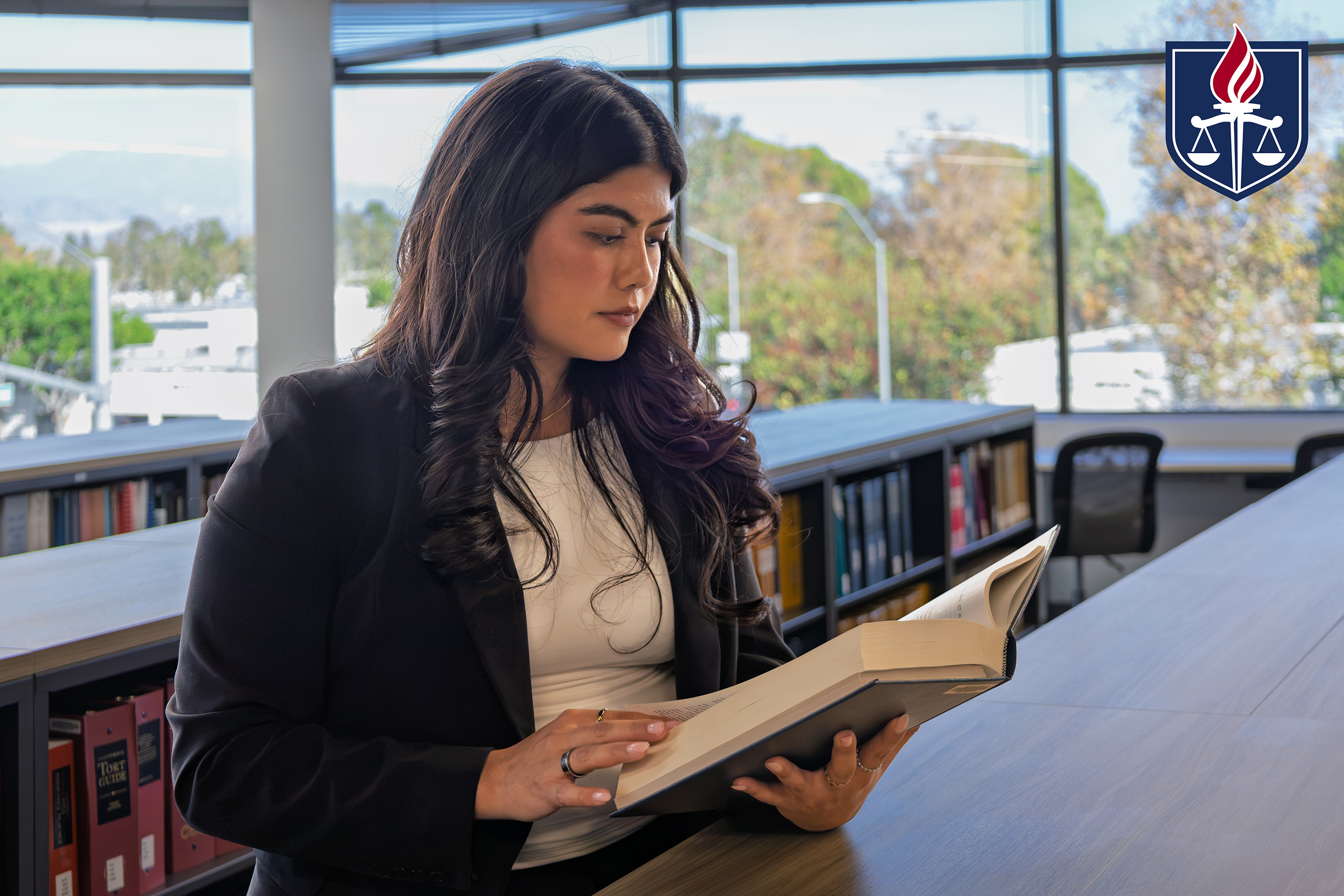 Emily Rivera reading book in WSCL library