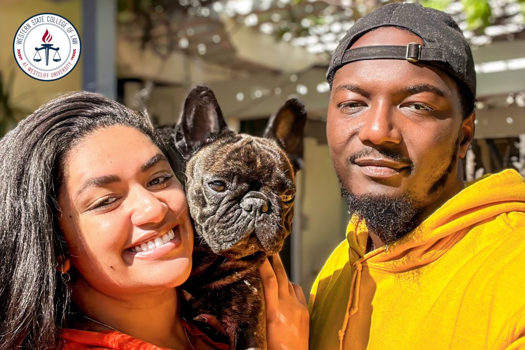 Fitzgerald Garraud with wife and pup.