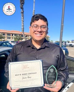 Jason Ruiz with award.