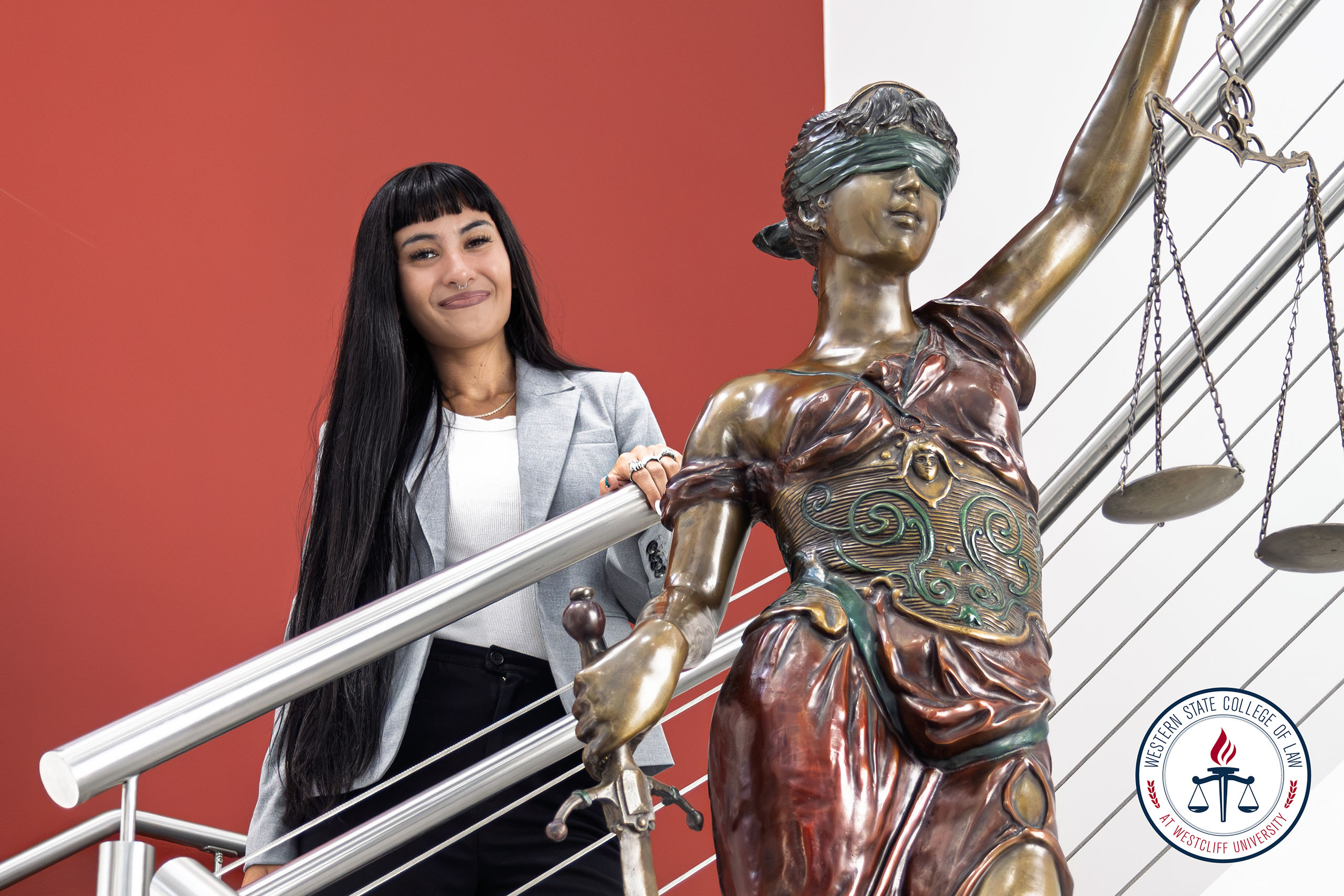 Juliet Poucher with Lady Justice in Western State Lobby