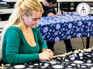 Karlee Wilkinson making a blanket.