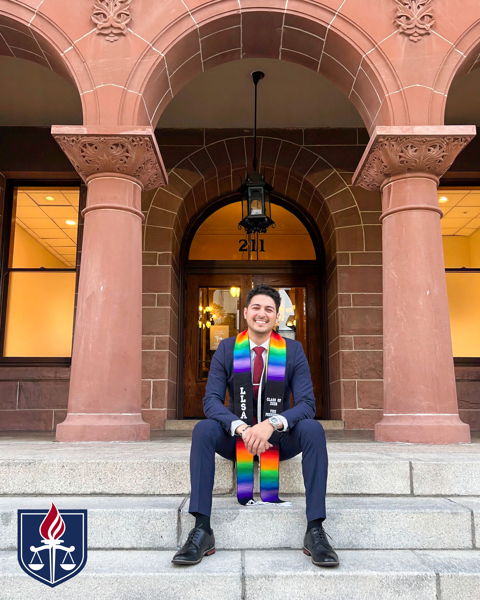 Kevin Torres in graduation stole