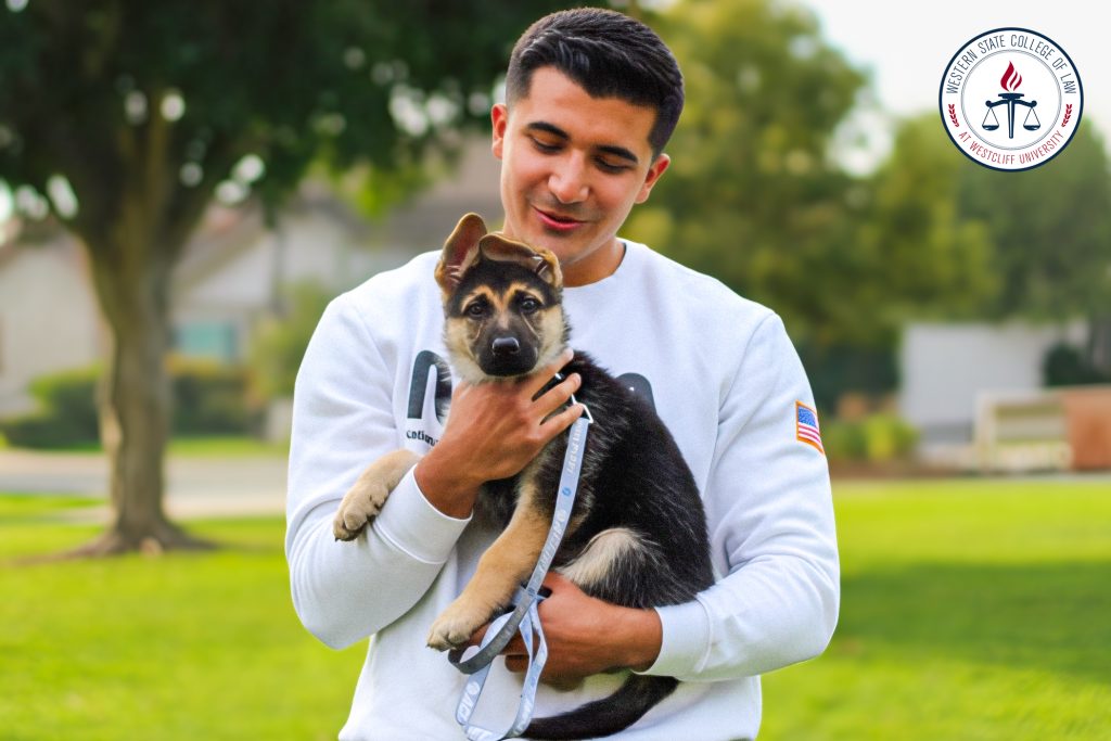 Luis Alvarez with his puppy.