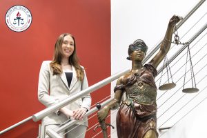 Macyn Sherman with Lady Justice.