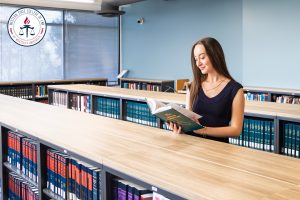 Noelle Nourafshan in the library.