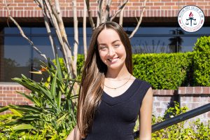 Noelle Nourafshan in front of the new building.