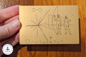 Robert Molko holding the Pioneer plaque