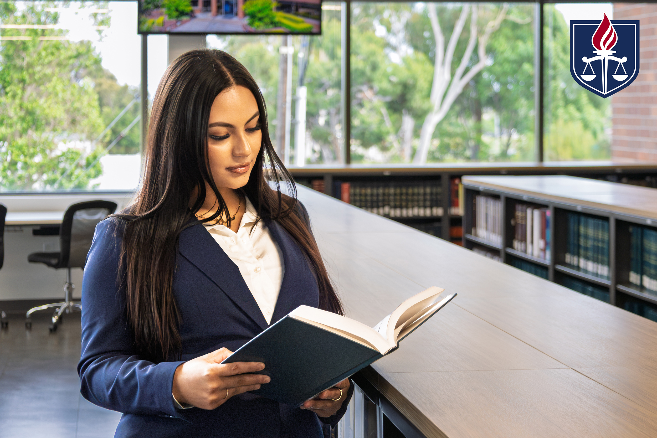 Samara Abdallah reading book at Western State library