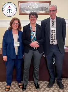 A photo of Susan Keller with the panelists.